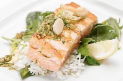 Grilled Salmon with Ginger-cilantro pesto on Sautéed Greens